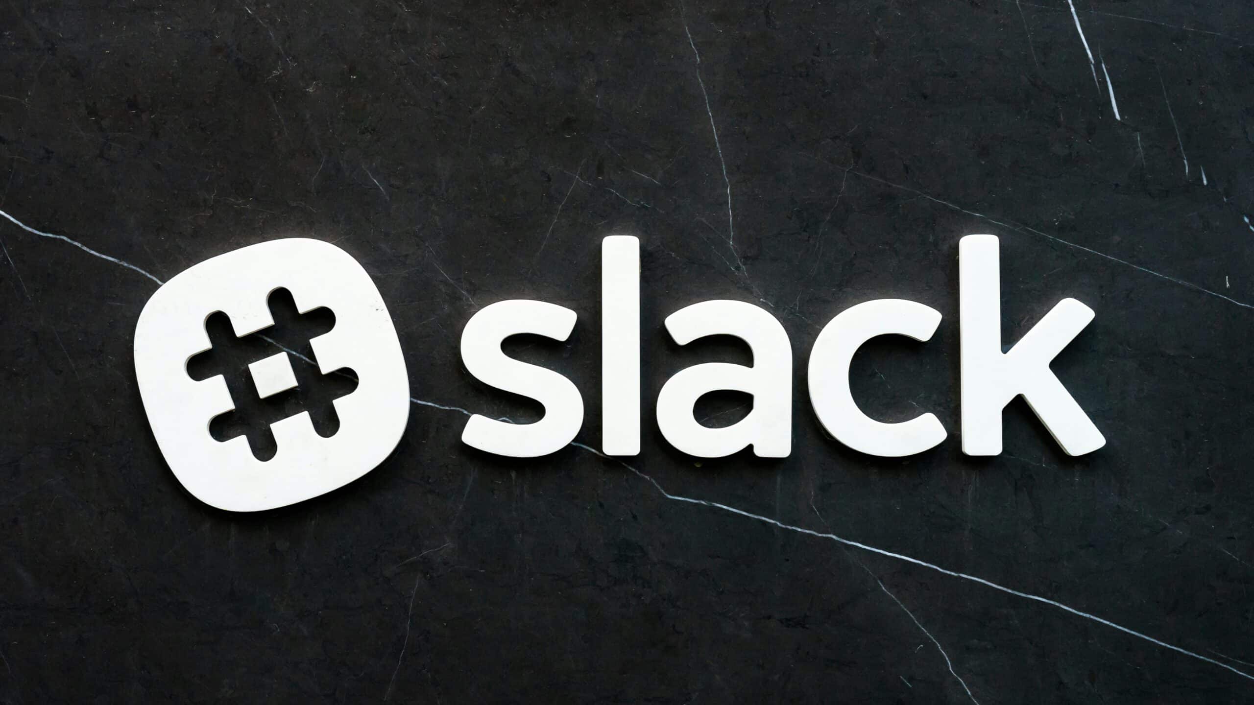 White Slack logo design over a black background