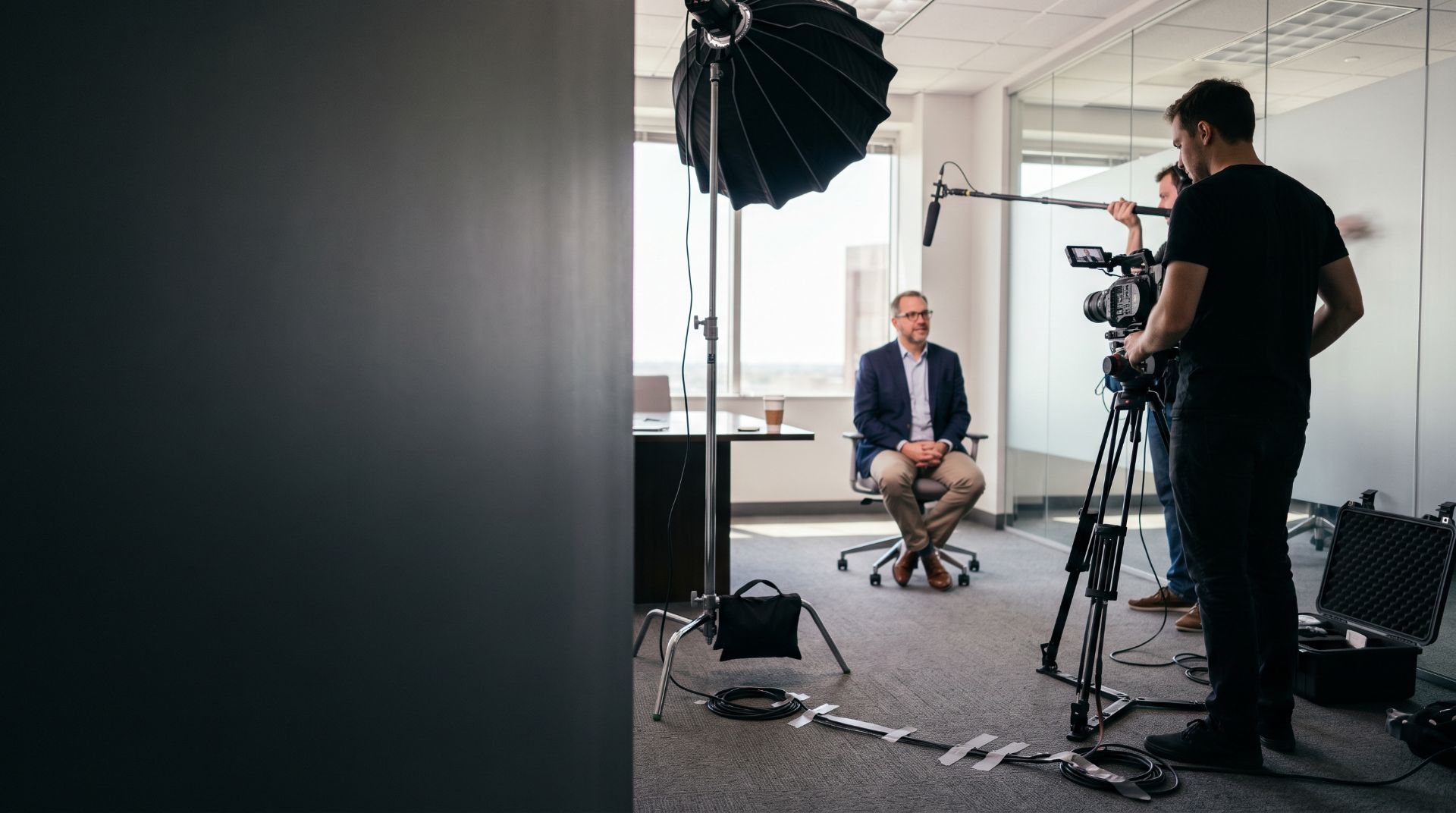 Crew filming an executive interview on location